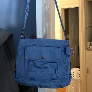 NWOT Coach periwinkle crossbody file bag with flower charm